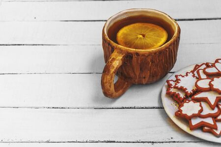 light breakfast with tea and homemade cookies  on wooden table