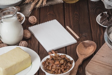 top view of wooden rustic kitchen board with organic ingredients for cooking cake. preparation for baking cake. culinary conceptの写真素材