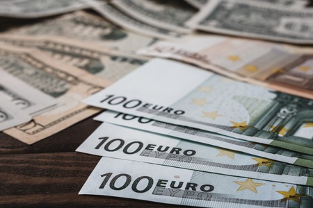 Background with money american dollar bills and euro banknotes on table. Money backgroundの写真素材