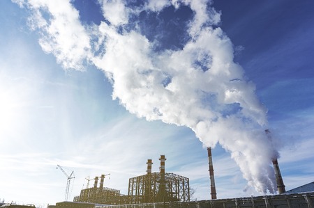 Industrial zone, Power energy station, electricity factory with pipes and smoke. Copy space