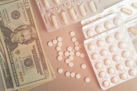 Money for health, Medicine pills, tablets and capsules on table. Drug prescription for treatment medication. healthcare conceptの写真素材