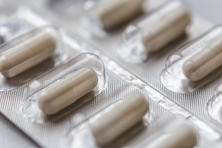 Pills in blister pack. Medications drugs and Health care concept. Macro close up photo.の写真素材