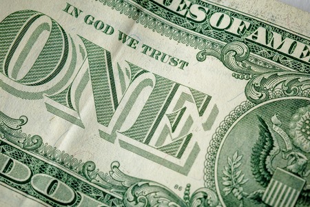 Caption: one and in God we trust on the one dollar bill. Cash, money, close-up photo