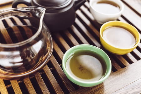 Chinese tea set, wooden teatable for tea ceremony background, Teapot and cupsの写真素材