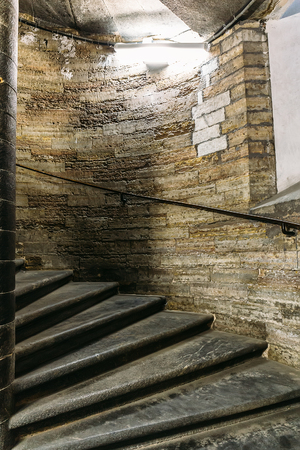 Ancient spiral staircase in the tower, vertical imageの写真素材