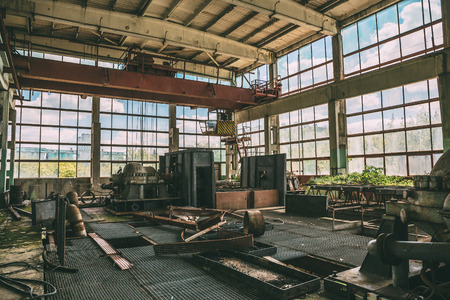 Large abandoned factory inside interior, large workshop with equipment