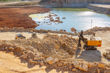 Quarry excavator heavy duty machine and other quarry equipment, view from aboveの写真素材