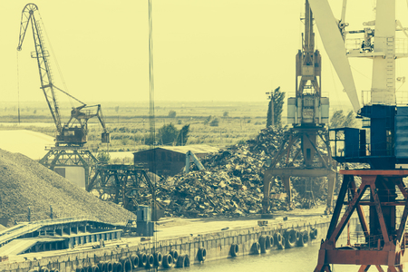 Industrial port area with cranes, industrial landscape, toned