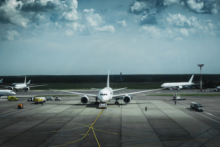 Airport with many airplanes, air transportation concept, tonedの写真素材