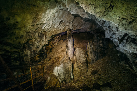 Entrance or descent to the Great Azish cave, stalactites and stalagmitesの写真素材