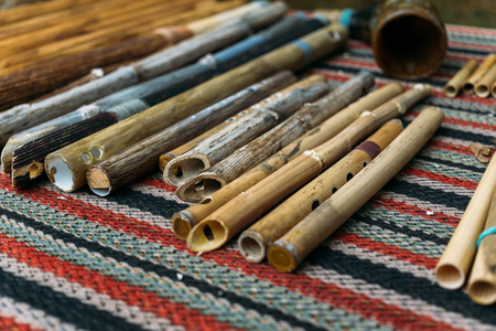 Ethnic woodwind flutes, wooden musical instruments handmade, selective focusの写真素材