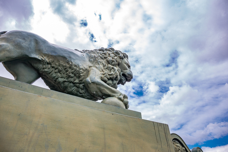 Lion statue at sky background, located in St. Petersburg, Russiaの写真素材
