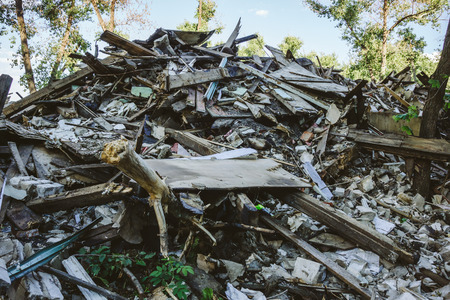 Large pile of rubbish, debris of a building, ruined house, can be used as consequences of war, earthquake, hurricane or other natural disasterの写真素材