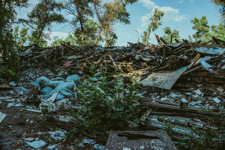 Large pile of rubbish, debris of a building, ruined house, can be used as consequences of war,...