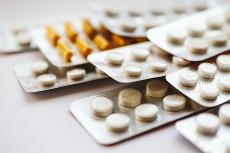 Different medicines: tablets, pills in blister pack, medications drugs, macro, selective focus, copy spaceの写真素材