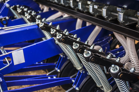 Part of agricultural harvester machinery equipment, industrial agriculture seeder, close-up