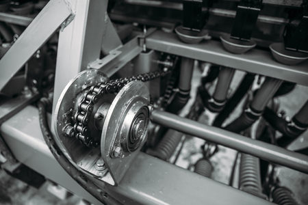 Industrial roller chain, technology background with selective focus, toned imageの写真素材