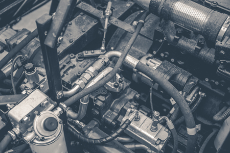 Harvester engine, gear chains, mechanisms transmission of new modern technology combine vehicle motor with metal, chrome, plastic parts, heavy agricultural industry equipment, black and white photoの写真素材
