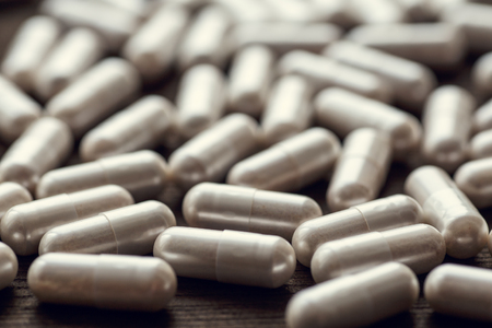 Medical pills and capsules background, group of drugs, selective focus, tonedの写真素材