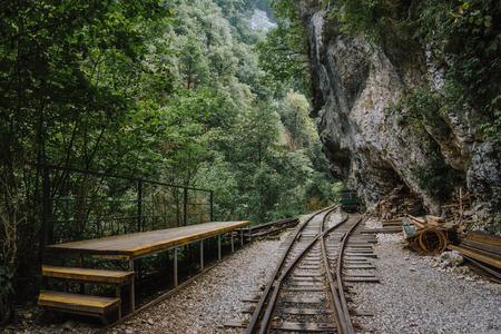 Old railroad or railway road in mountain landscape, tonedの写真素材