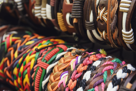 Braided handmade leather bracelets background, tonedの写真素材
