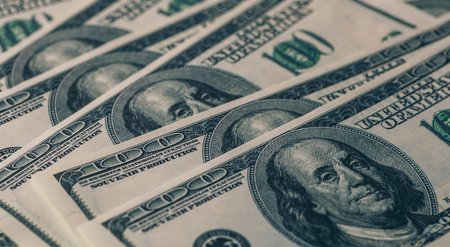 Dollars background, heap of hundred USA dollar banknote bills, many American cash money with Benjamin Franklin, tonedの写真素材