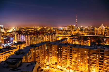 Aerial view at evening cityscape, Voronezh city downtown panorama, high-rise residential houses,  business buildings, illuminated urban after dawnの写真素材