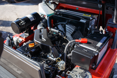 Modern hi-tech engine or motor of industrial loader or combine vehicle or small tractor, close up