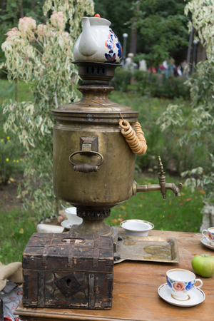 Russian traditional tea drinking samovar. Old vintage antique kitchen utensil, vertical photoの写真素材