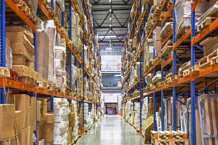 Large Logistics hangar warehouse with lots shelves or racks with pallets of goods. Industrial shipping and cargo delivery distribution conceptの写真素材