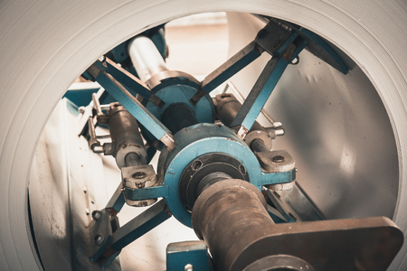 Roll of galvanized steel sheet close up, ironworks and metalwork manufacturing factory, tonedの写真素材
