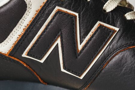 Moscow, Russia - Circa August 2018 : New Balance Shoes logo - letter N on new leather sneakers. New Balance - American manufacturer of sportswear founded in 1906のeditorial素材
