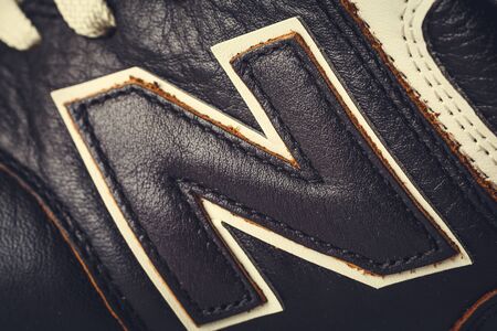 Moscow, Russia - Circa August 2018 : New Balance Shoes logo - letter N on new leather sneakers. New Balance - American manufacturer of sportswear founded in 1906のeditorial素材