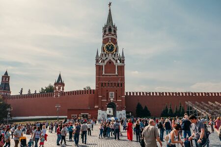Moscow, Russia - September 2018 : Tourists behind The Spasskaya Tower is the main thoroughfare tower of the Moscow Kremlin located on Red Square, was built in 1491のeditorial素材