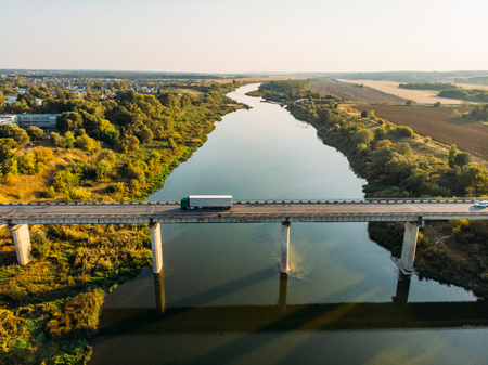 Aerial view of bridge over Don river in Voronezh, autumn landscape from above view with highway road and car transportation, tonedの写真素材