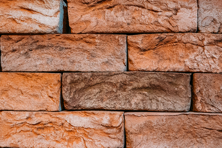 Old vintage brick wall surface texture background, grunge rough concrete blocks backdrop for design, close upの写真素材