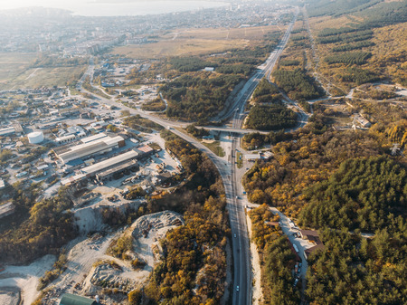 Aerial view of asphalt roads infrastructure at root of a mountain, tonedの写真素材
