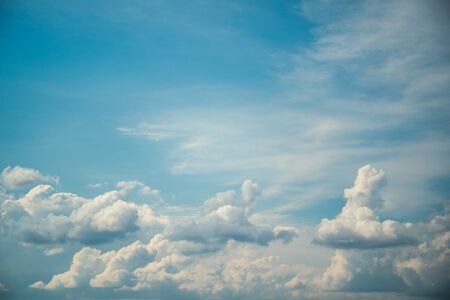 Blue sky with white clouds in windy sunny weather, heaven background.