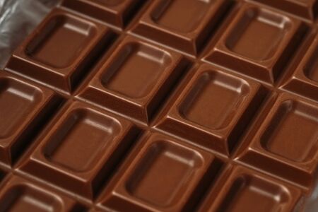 Chocolate bar background, tasty sweet snack, macro photo.の写真素材