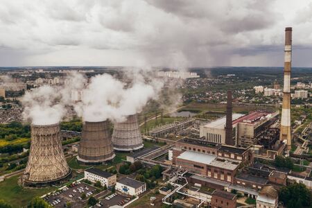 Smoke from chimneys of thermal power plant or station, aerial view from drone, tonedの写真素材