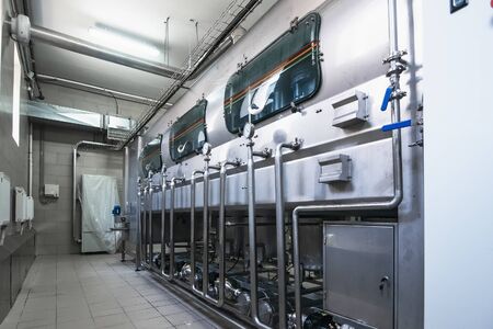 Machine for washing and disinfecting plastic bottles at factory for production of purified drinking...