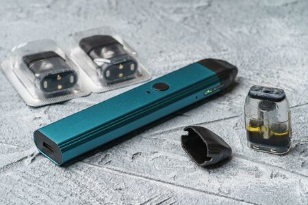 Vape pod system or pod mod with changeable cartridges close up - newest generation of vaping products - small size devices for inhaling higher nicotine strengths.の写真素材
