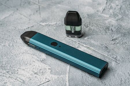 Vape pod system or pod mod with changeable cartridges close up - newest generation of vaping products - small size devices for inhaling higher nicotine strengths.の写真素材