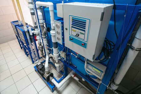 Automated computerized ozone generator machine for ozonation of pure clean drinking water in water production factory, close upの写真素材