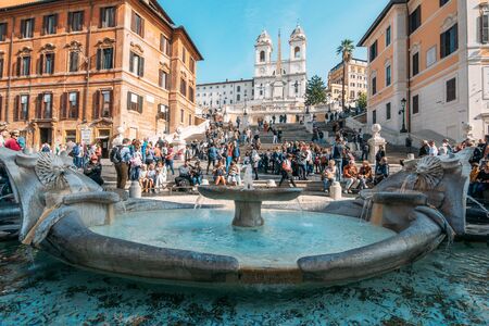 Rome, Italy - Circa October 2019: Many tourists on Spanish Steps and fountain in sunny day, Rome, Italy.のeditorial素材