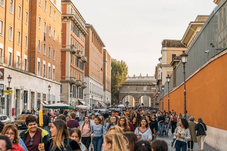 Rome, Italy - circa October, 2019: Crowd of tourists people on street near gate to Vatican and San Pietro square in Rome, Italy.のeditorial素材