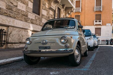 Rome, Italy - October 2019 : Old Vintage retro Fiat Car parked on Roman street in center of city.