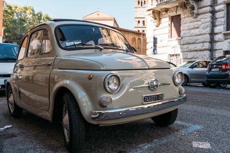 Rome, Italy - October 2019 : Old Vintage retro Fiat Car parked on Roman street in center of city.