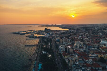 Limassol, Cyprus aerial panoramic view at sunset. Evening mediterranean resort town or city with...