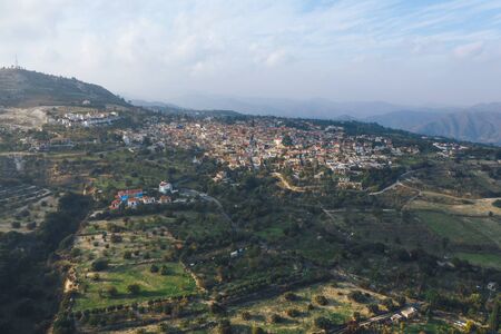 Aerial view of famous landmark valley Pano Lefkara village, Larnaca, Cyprus with orange ceramic roofs, drone photo.の写真素材